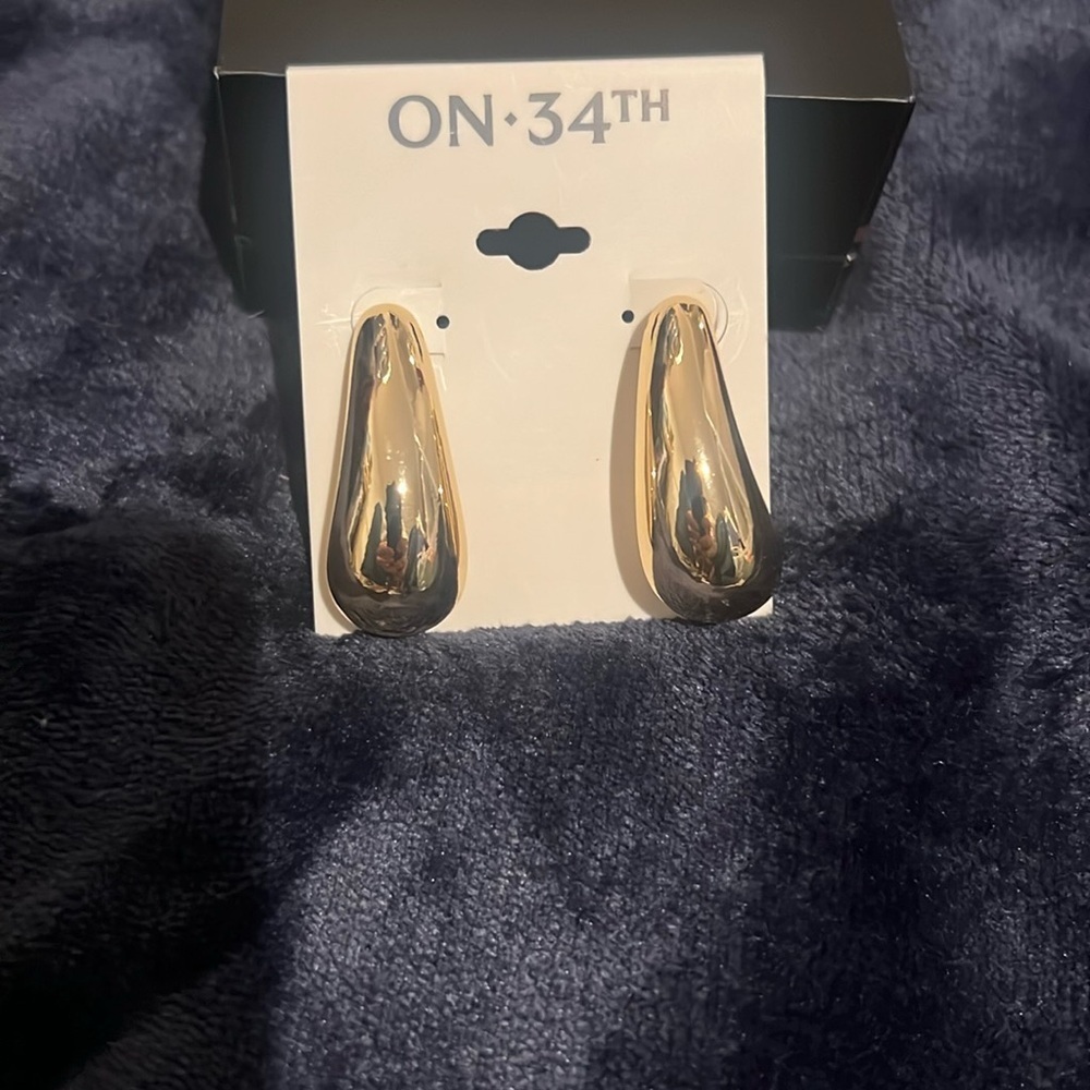 On 34th gold drop earrings